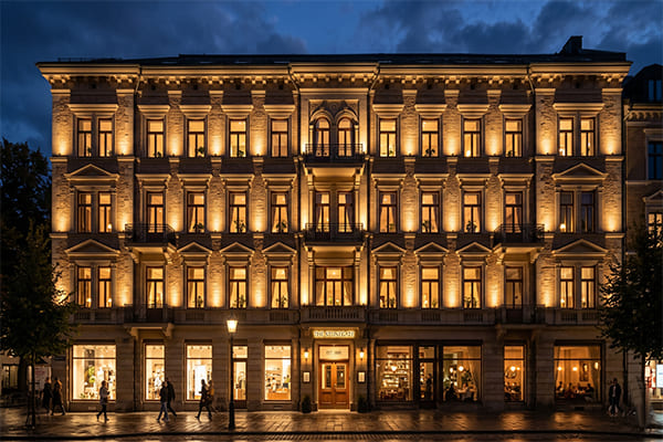A facade lit with warm white 3000K light, showing a soft and even glow